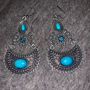 Silver chandelier earrings with teal stones